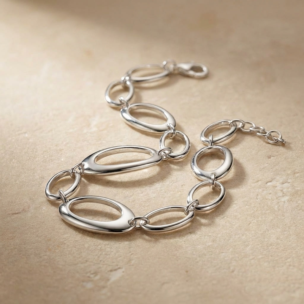 Silver bracelet on a beige background
