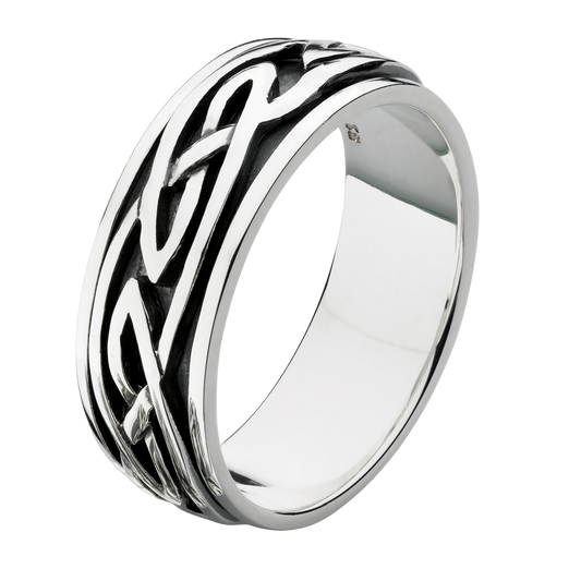 Silver spinning ring with intricate Celtic knot design on a white background