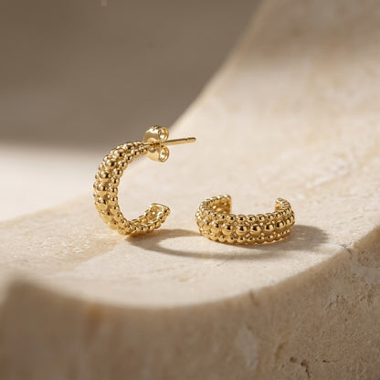 Gold Plate 13mm Triple Beaded Stud Hoop Earrings on a textured beige surface