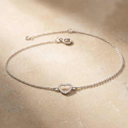 Open Heart Cubic Zirconia Braceleton a beige background
