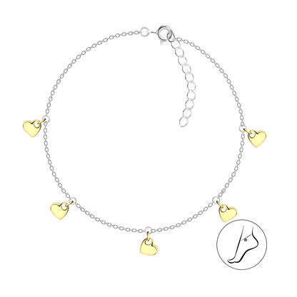 Silver anklet with gold heart charms on a white background