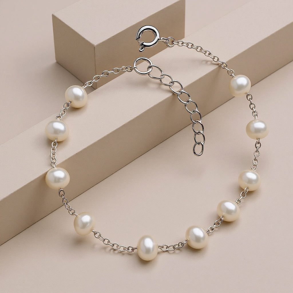 Pearl bracelet on a beige geometric background