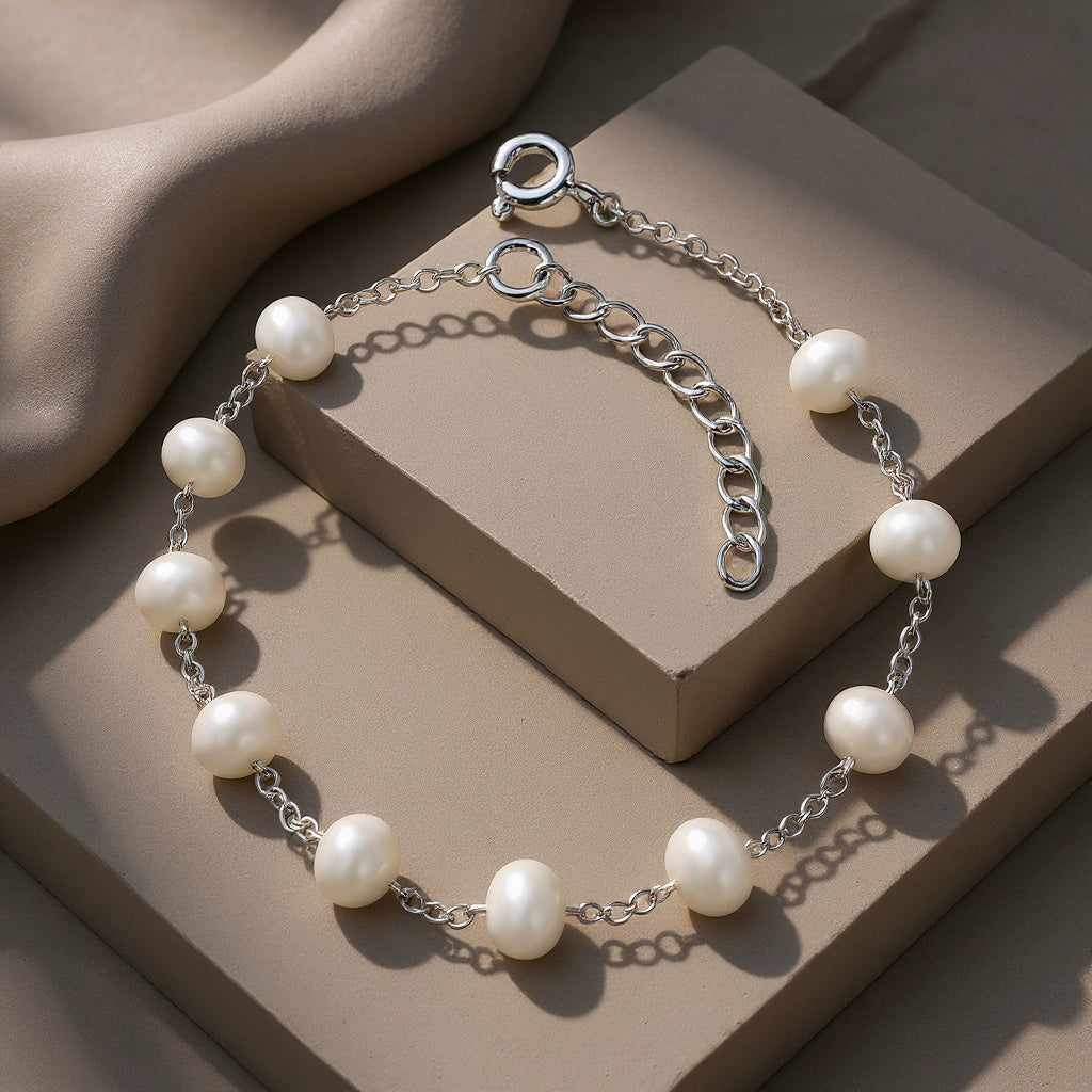 Pearl bracelet on a beige surface