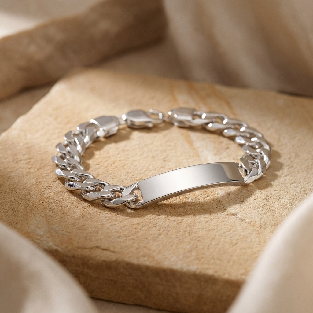 Silver chain bracelet on a beige fabric background