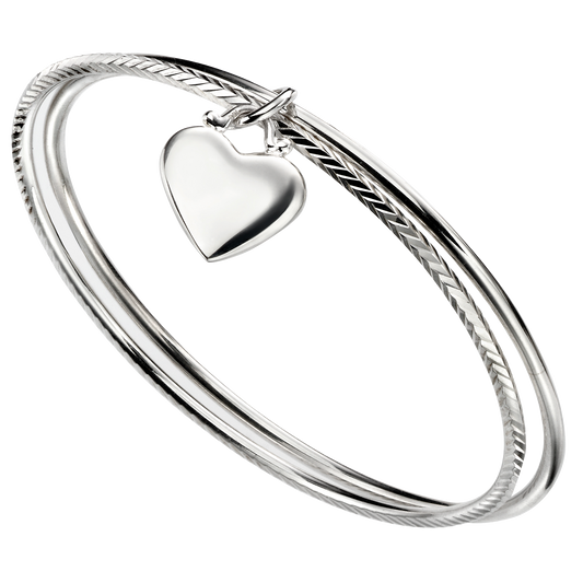 Silver bangle with a heart-shaped charm on a white background