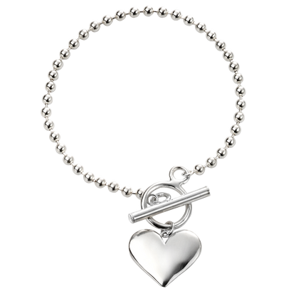 Silver bracelet with a heart-shaped charm on a white background