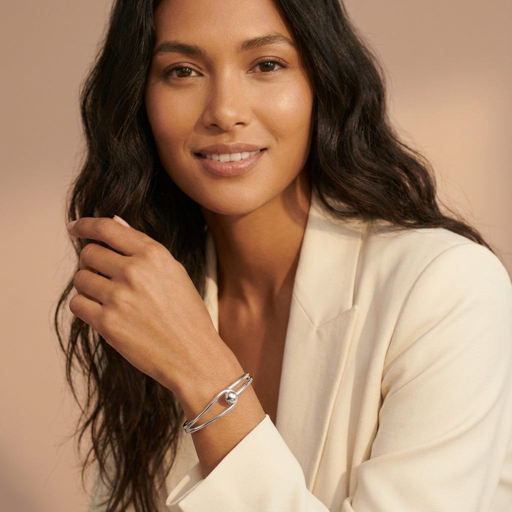 Oval Bangle with Feature Ball Clasp