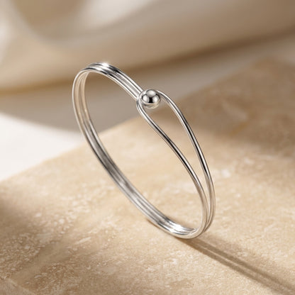 Oval Bangle with Feature Ball Clasp