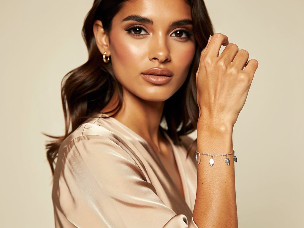 Woman wearing a bracelet on a beige background
