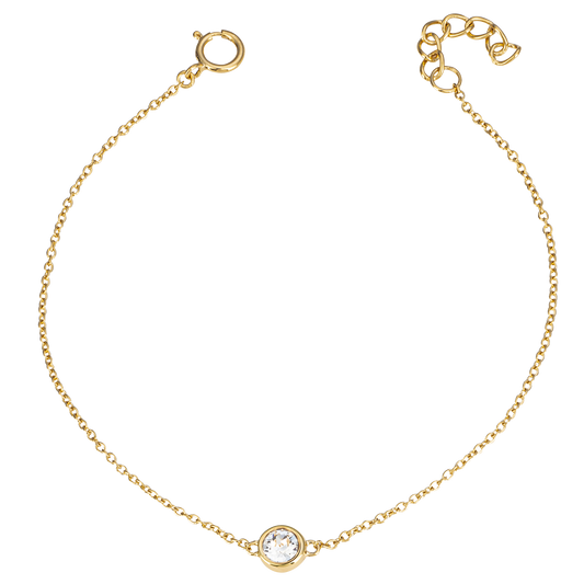 Gold bracelet with a small round gemstone on a white background
