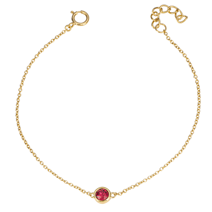 Gold bracelet with a red gemstone on a white background