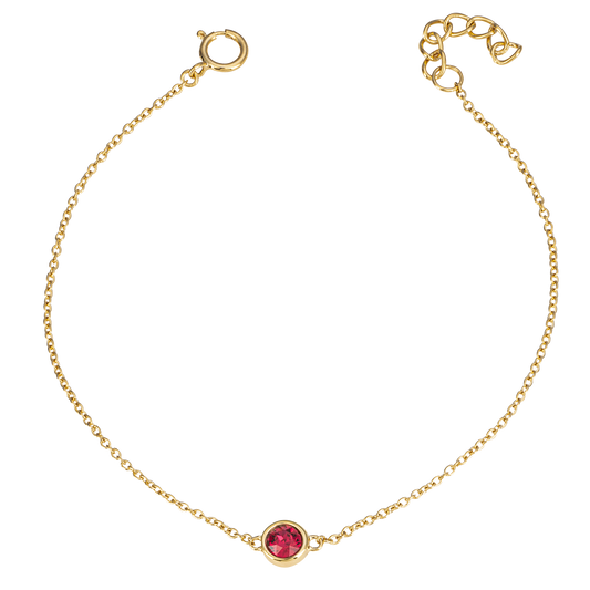 Gold bracelet with a red gemstone on a white background