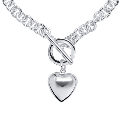 Detail - Silver necklace with a heart-shaped pendant on a white background
