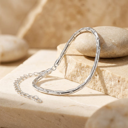 Silver bracelet on a natural stone surface