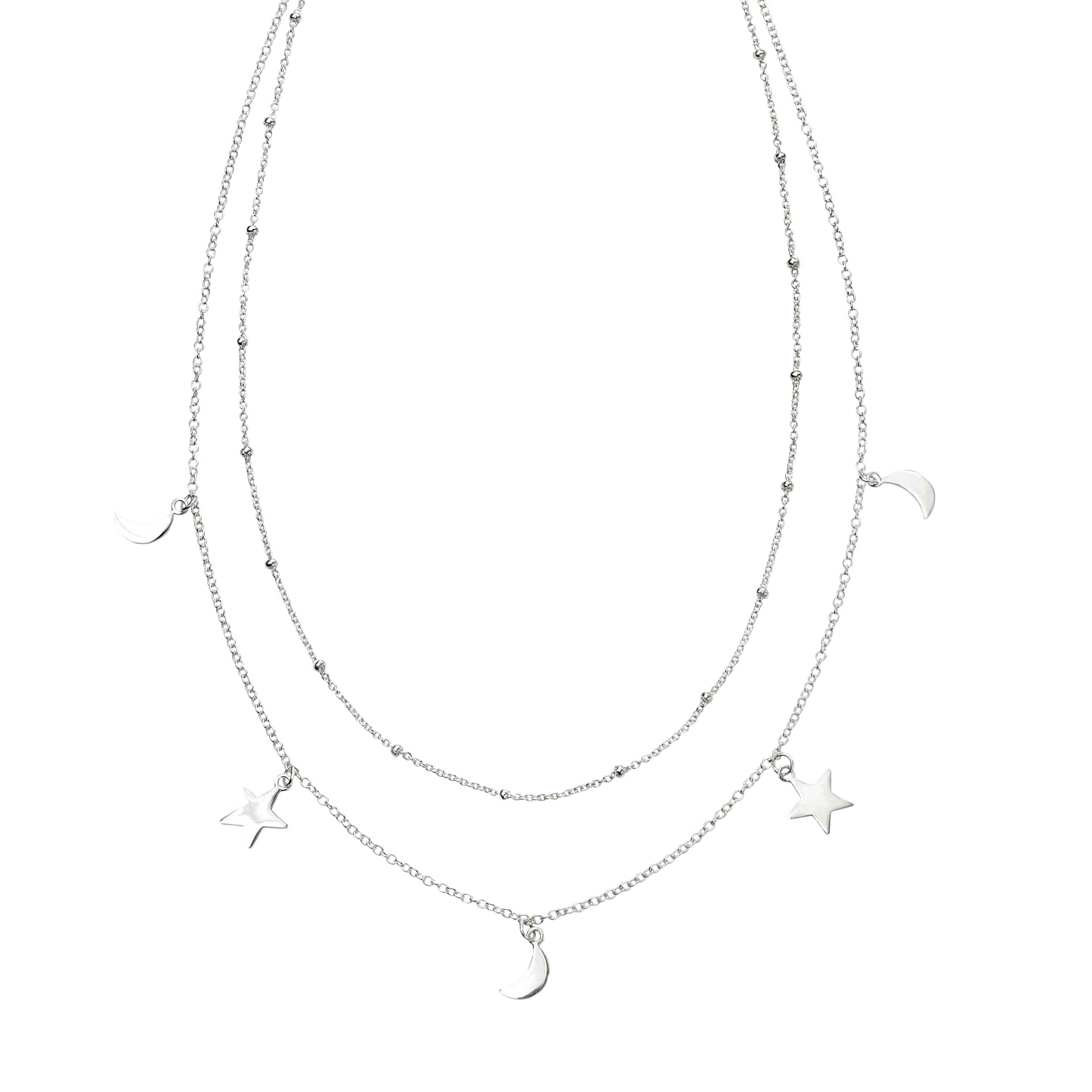 Layered silver necklace with star and moon pendants on a white background
