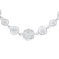 Silver necklace with floral designs on a white background