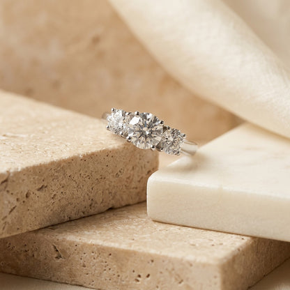 Diamond ring on a textured beige surface