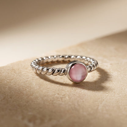 Twisted Pink Pearl Ring on a beige background