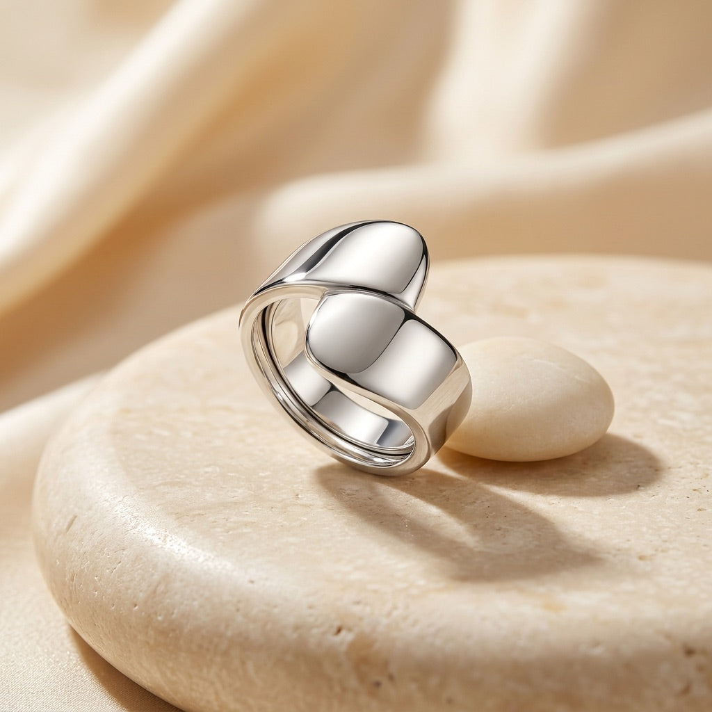Silver Wrap Ring on a beige stone surface