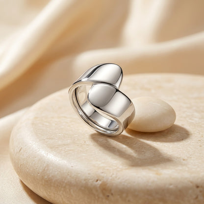 Silver Wrap Ring on a beige stone surface
